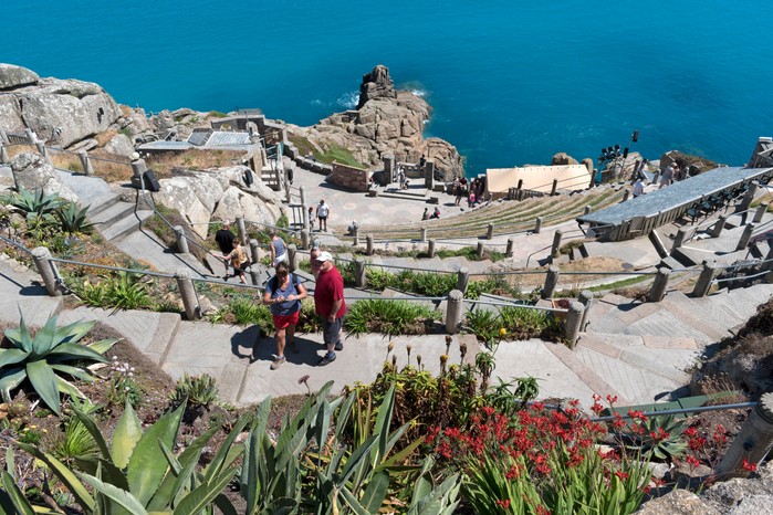 Visitors at the minack an open air theatre near Porthcurno in Cornwall,