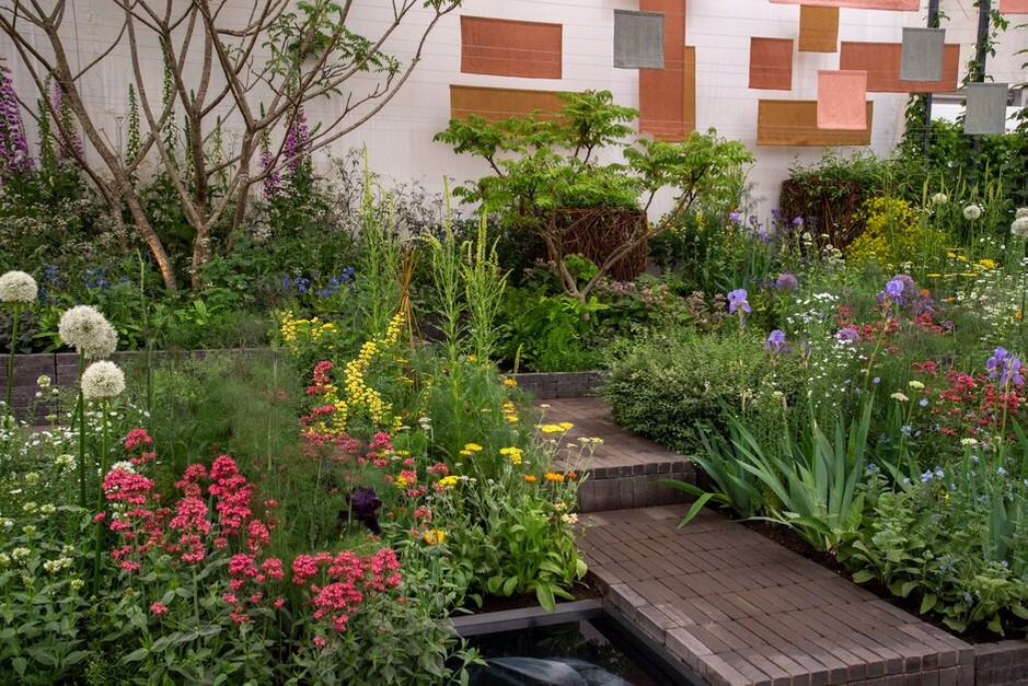 A Textile Garden for Fashion Revolution designed by Lottie Delamain at RHS Chelsea Flower Show 2022.