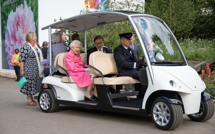 Britain's Queen Elizabeth tours the gardens in a buggy with RHS president Keith Weed during a royal visit to RHS Chelsea Flower Show 2022