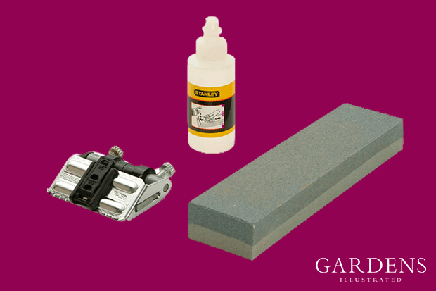 Stanley Sharpening Stone Oil and Honing Guide on a pink background