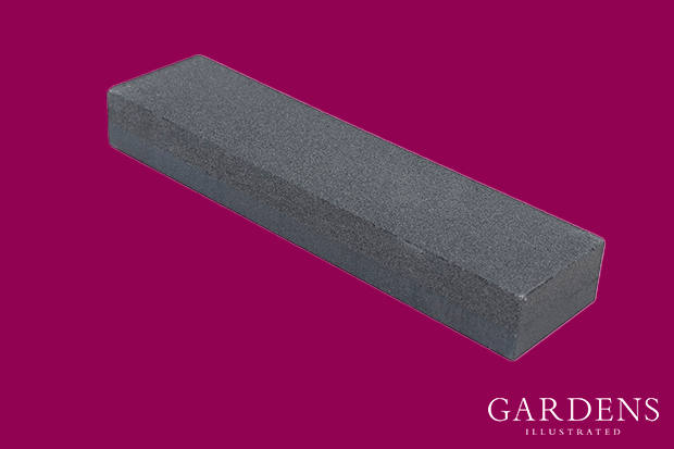 Wickes General Purpose Sharpening Stone on a pink background
